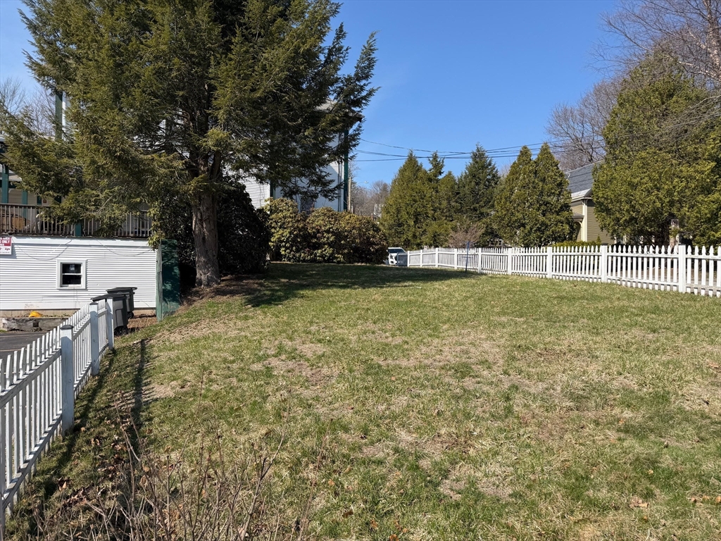 35 Cedar Street, Unit 2 Gardner, MA 01440 - Photo 32 of 32 a view of a backyard with a small pool and trees