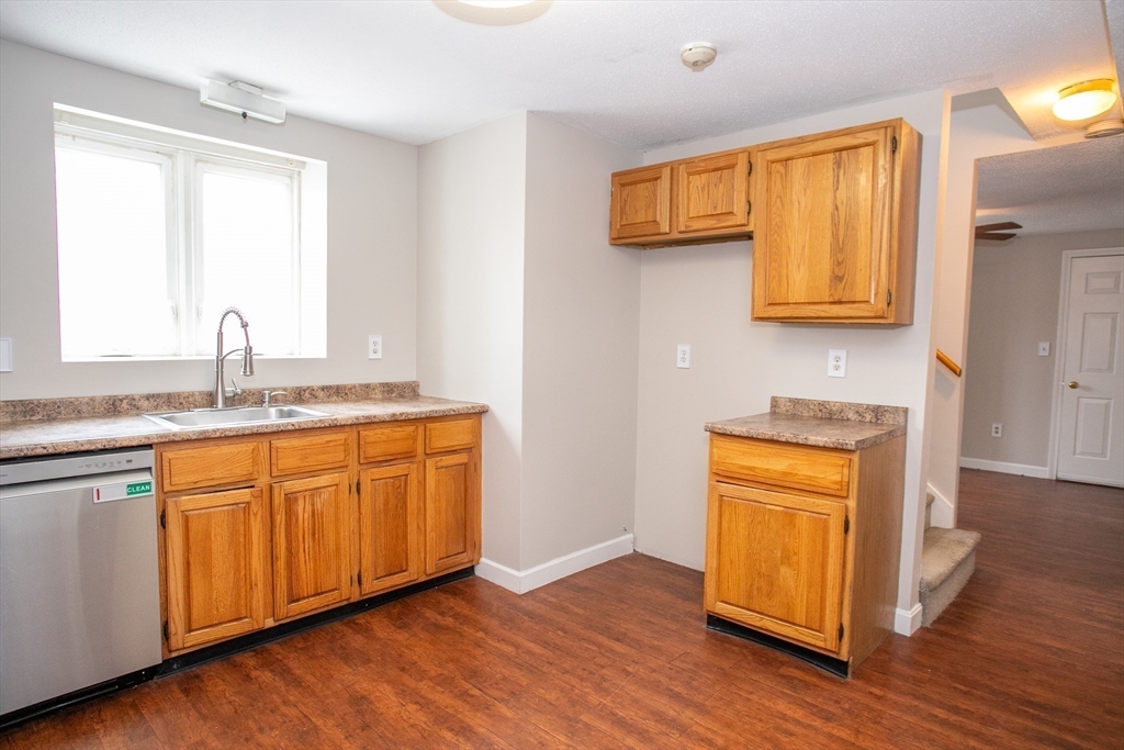35 Cedar Street, Unit 2 Gardner, MA 01440 - Photo 7 of 32 a bathroom with a sink and a mirror