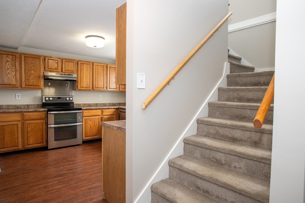 35 Cedar Street, Unit 2 Gardner, MA 01440 - Photo 8 of 32 a kitchen with granite countertop a stove and a sink
