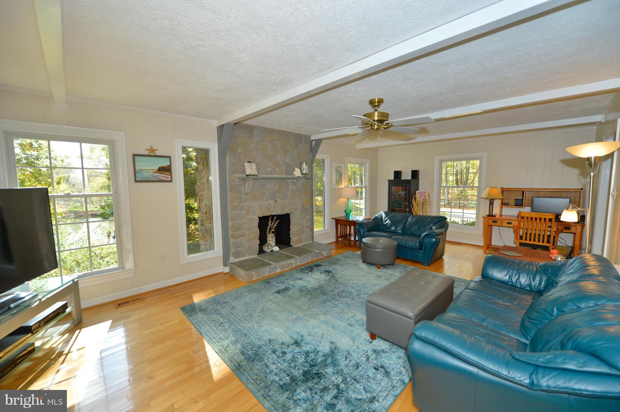 37340 Bolyn Road Purcellville, VA 20132 - Photo 8 of 30 Family Room w/Wood Burning Fireplace and pond view
