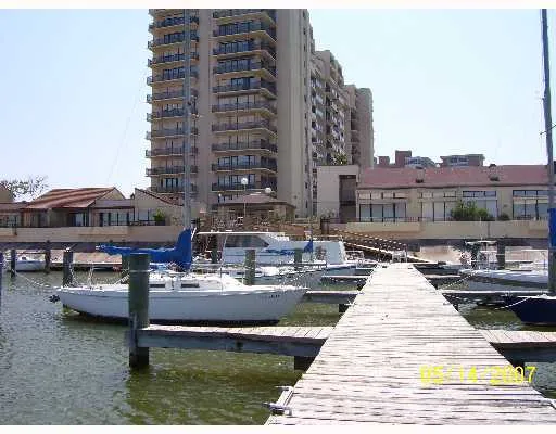a view of swimming pool with outdoor seating and city view