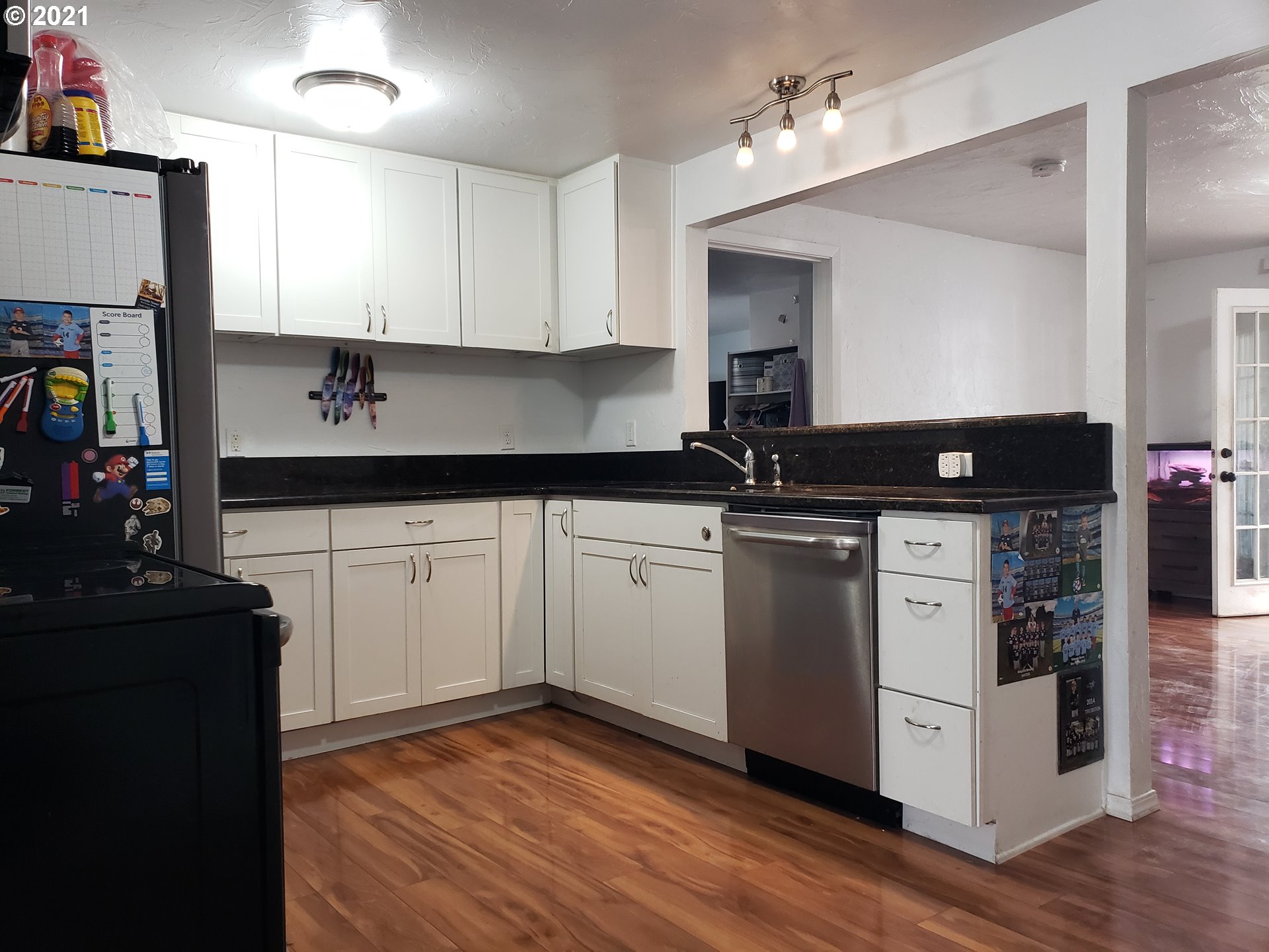 189 33rd Street Springfield, OR 97478 - Photo 5 of 24 a kitchen with a sink stove and cabinets