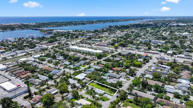 an aerial view of residential houses with city view