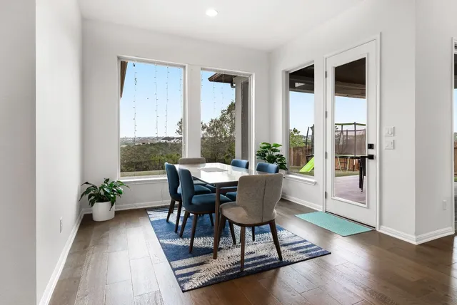 a kitchen with stainless steel appliances granite countertop a sink and a stove