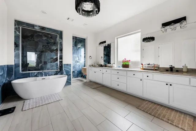 a living room with furniture and a ceiling fan