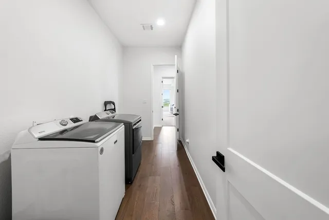 a spacious bathroom with double vanity sinks a bathtub and a shower