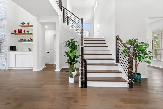 a bathroom with a granite countertop sink and a toilet