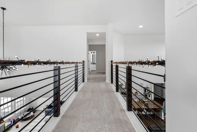 a dining room with furniture and a window