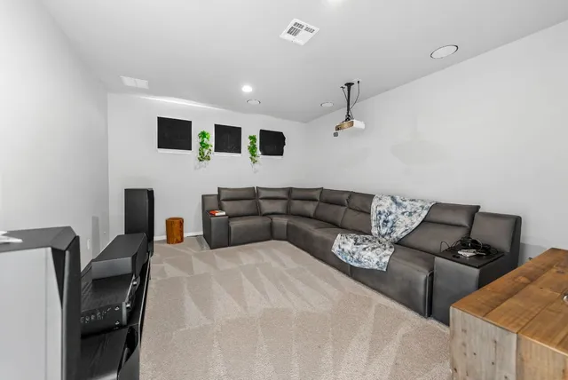 a living room with furniture and a garage
