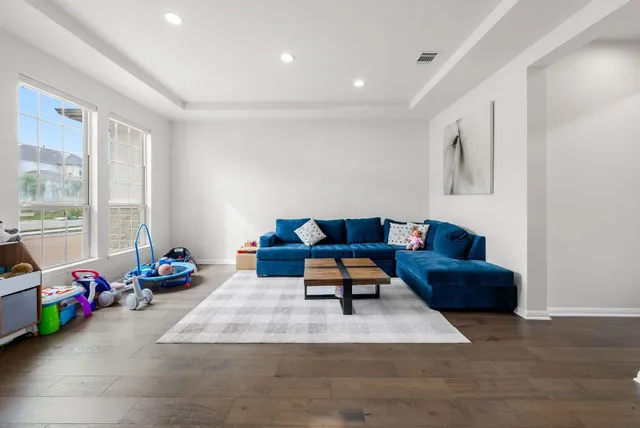 a living room with furniture and a table