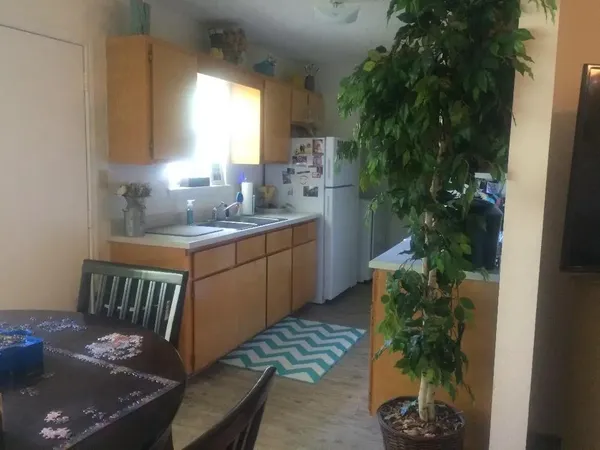 a kitchen with sink and window