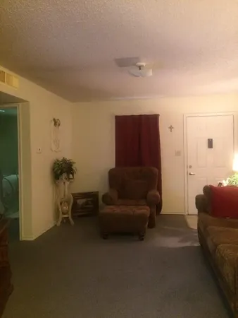 a living room with furniture and a couch
