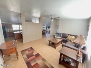 13643 East Bright Sky Loop Vail, AZ 85641 - Photo 12 of 22 a living room with furniture and a wooden floor