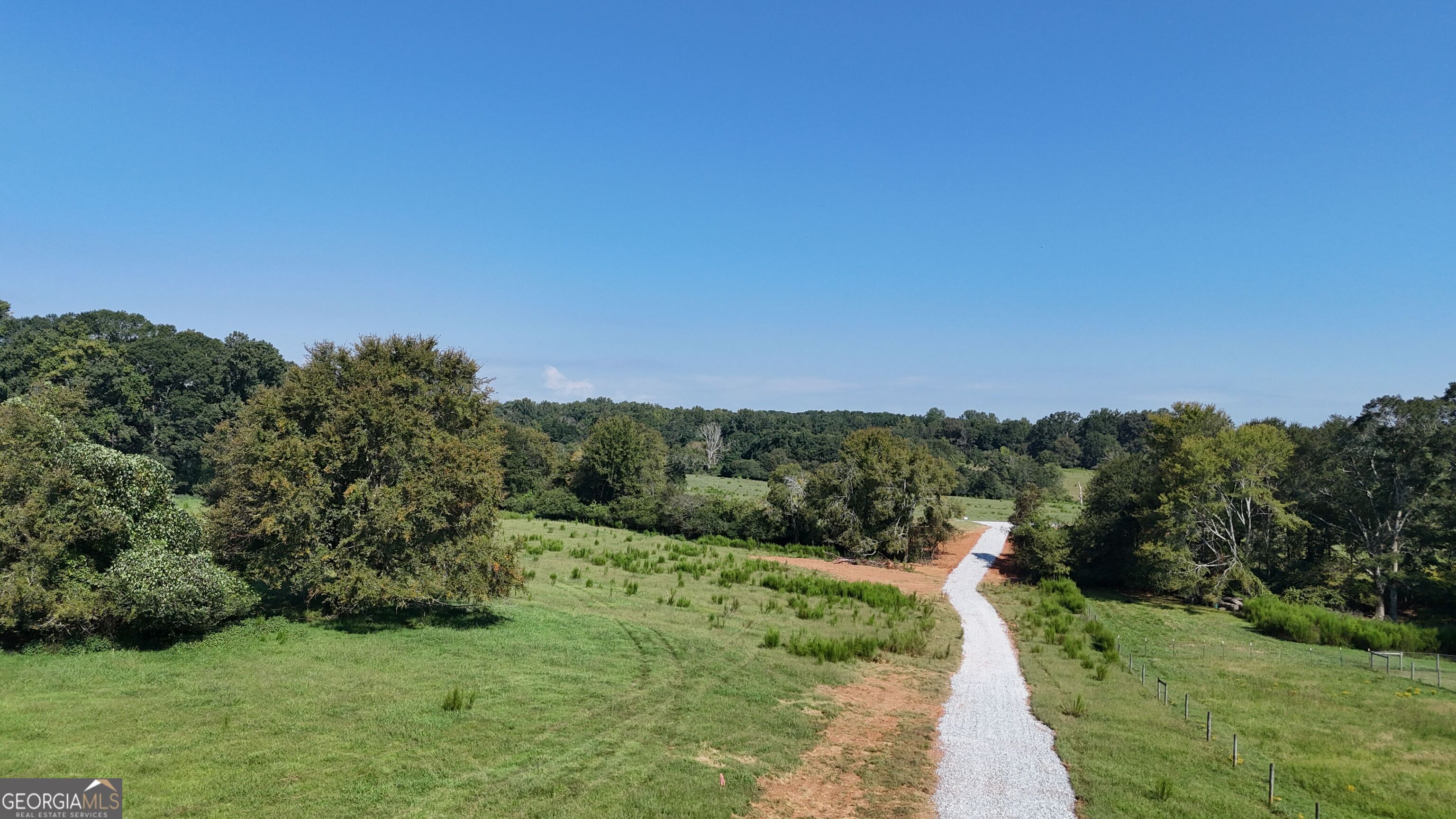 7 Red Rose Court Nicholson, GA 30565 - Photo 29 of 81 a view of a pathway both side of grassy field with shrub