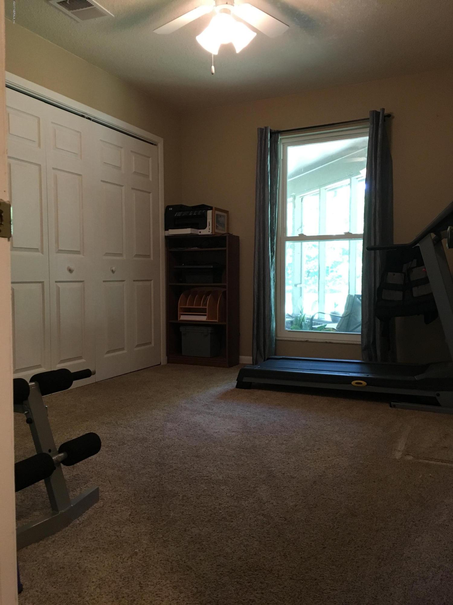 3098 Pacetti Road, Unit LOT I St. Augustine, FL 32092 - Photo 18 of 37 a view of a livingroom with furniture and a window