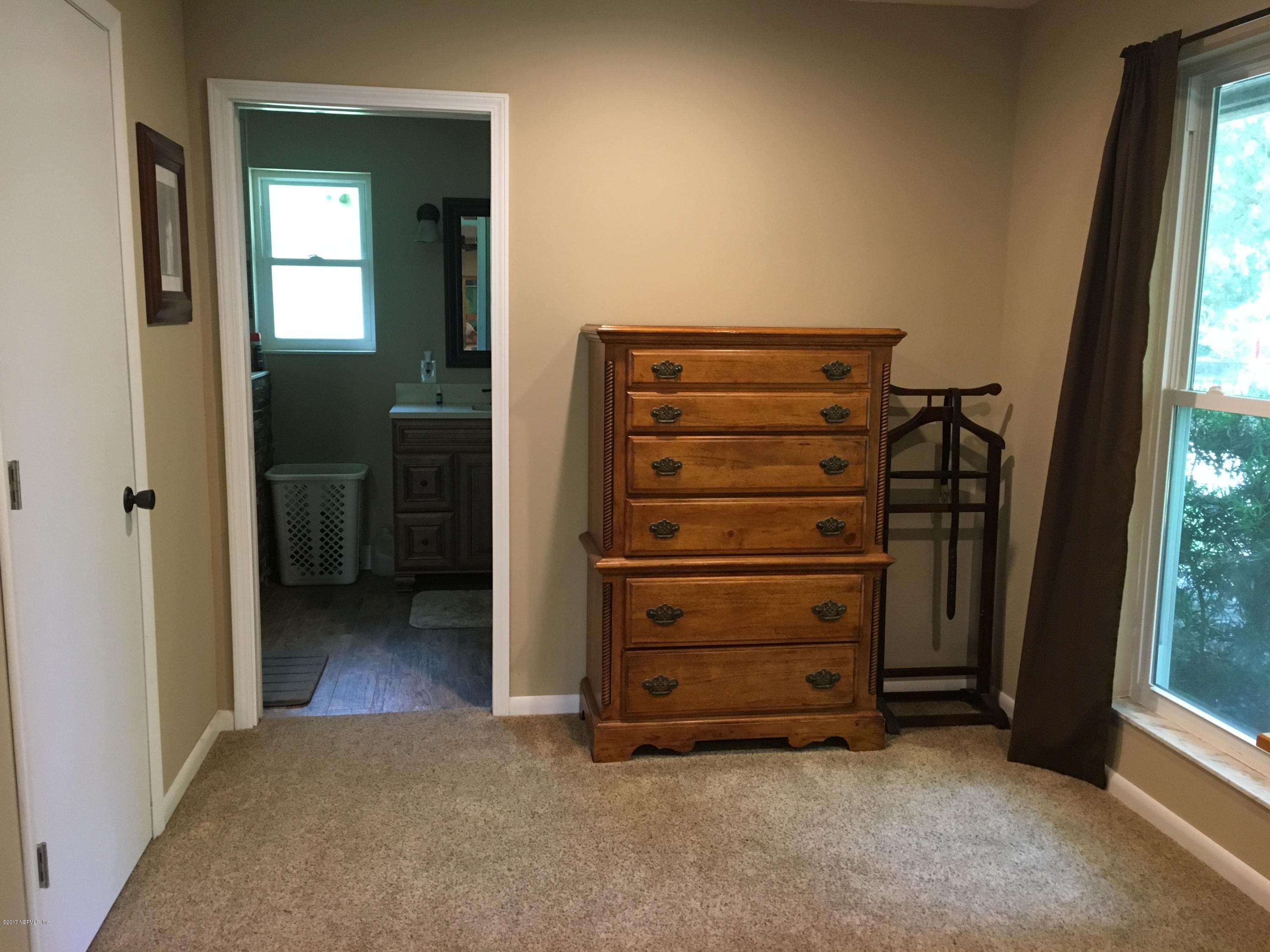 3098 Pacetti Road, Unit LOT I St. Augustine, FL 32092 - Photo 23 of 37 a view of walk in closet with clothes
