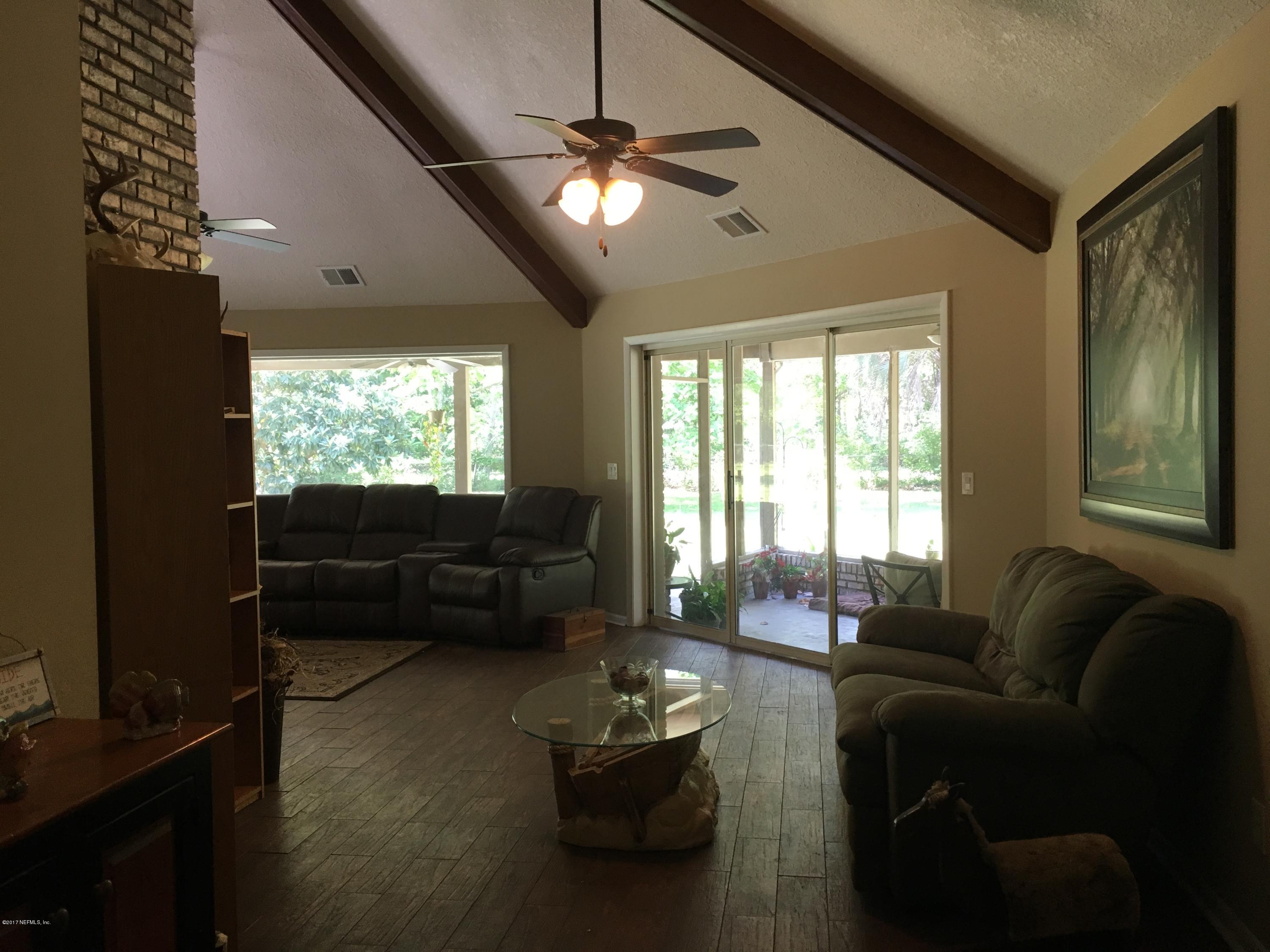 3098 Pacetti Road, Unit LOT I St. Augustine, FL 32092 - Photo 4 of 37 a living room with furniture and a large window