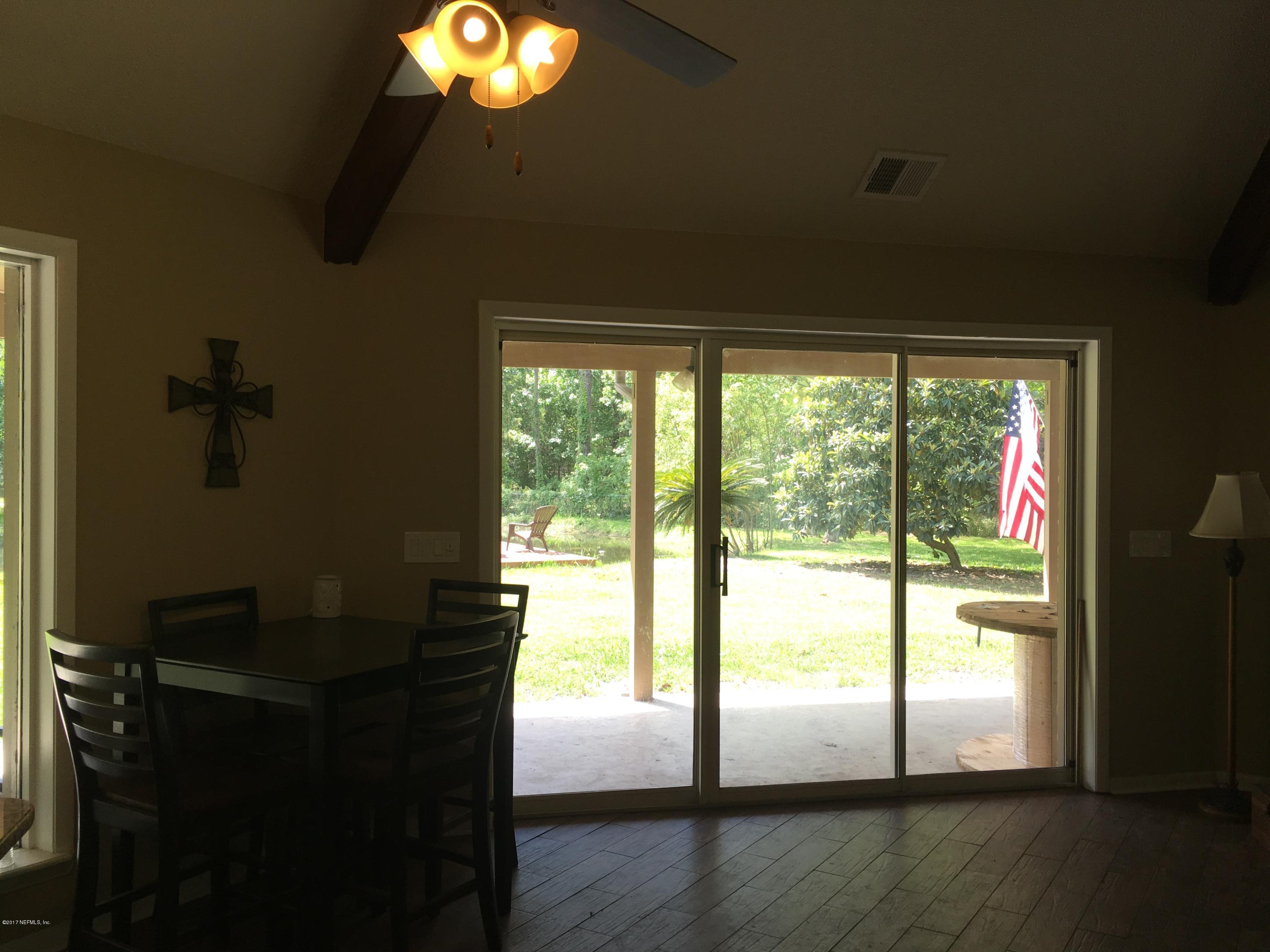 3098 Pacetti Road, Unit LOT I St. Augustine, FL 32092 - Photo 9 of 37 a view of empty room with wooden floor and fan