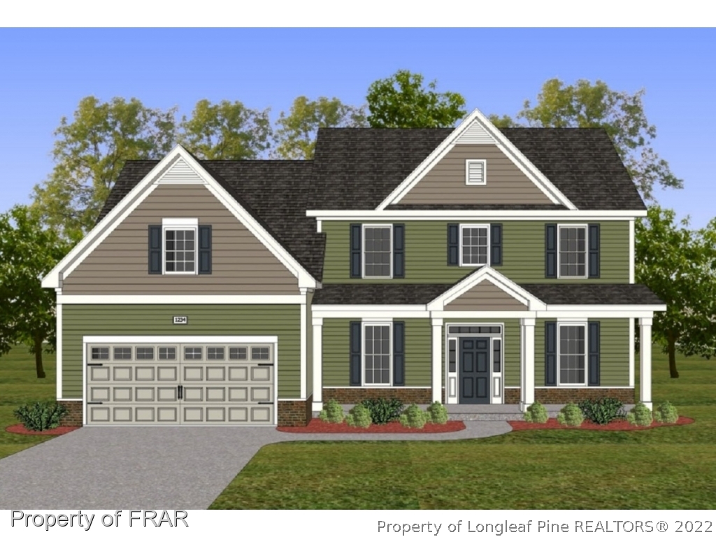 6736 Running Fox Road Hope Mills, NC 28348 - Photo 1 of 1 a front view of a house with a yard