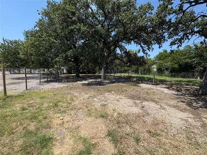 a view of outdoor space with deck and yard