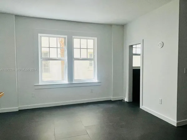 an empty room with windows