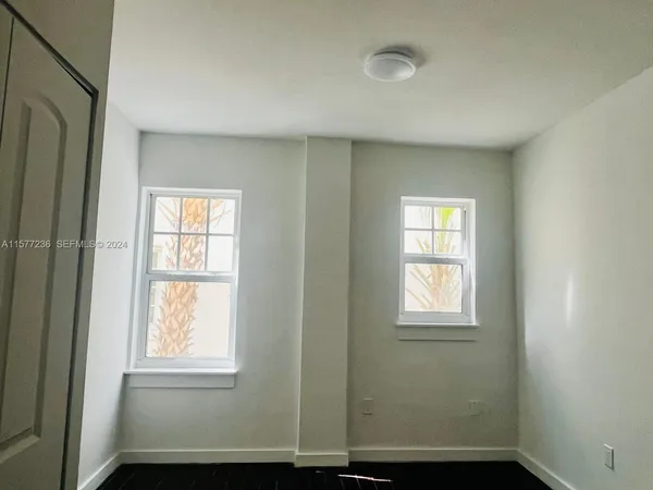 a view of an empty room with a window