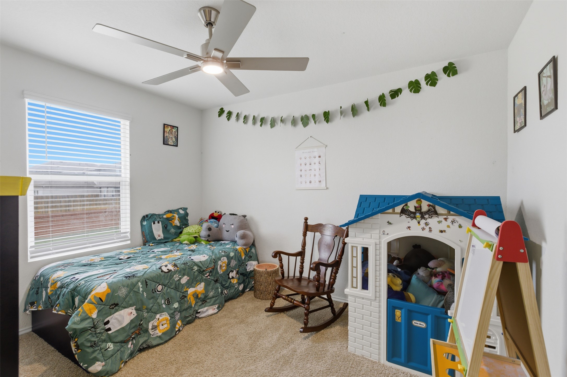 19017 Romano Drive Elgin, TX 78621 - Photo 23 of 33 Spacious room featuring neutral carpeting, white walls, and a window with horizontal blinds