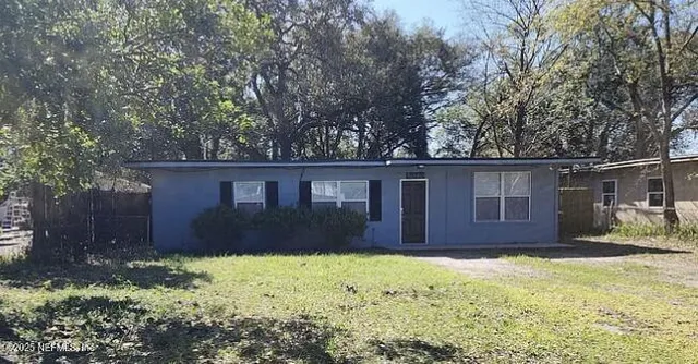 a house that has tree in front of it