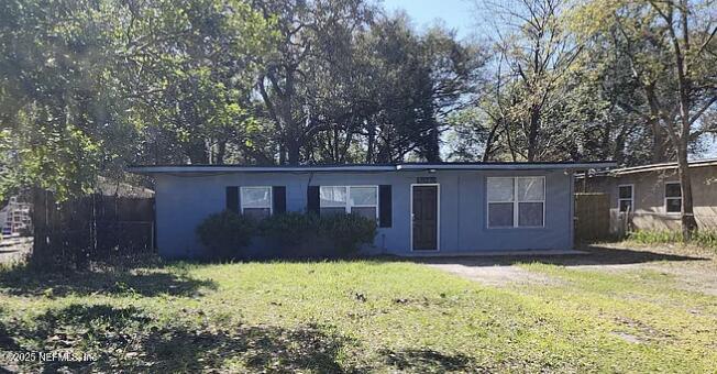 a house that has tree in front of it