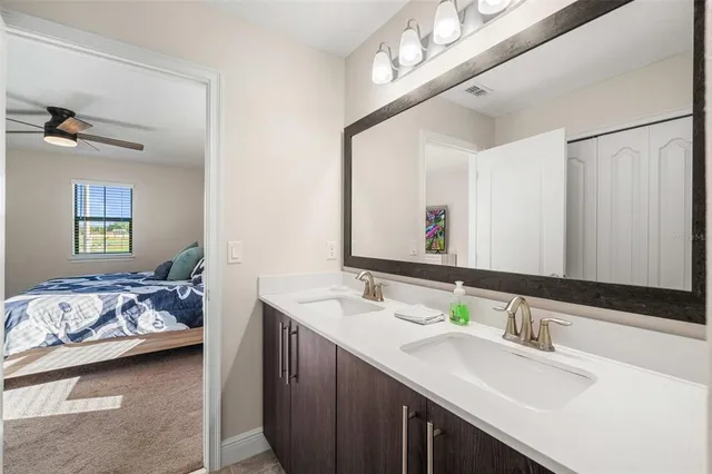 a bathroom with a glass shower door