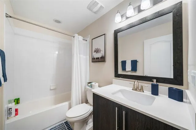 a bedroom with bed and a window