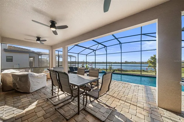 a view of a swimming pool with a patio
