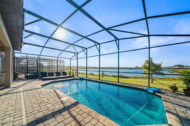 a view of a backyard with sitting area