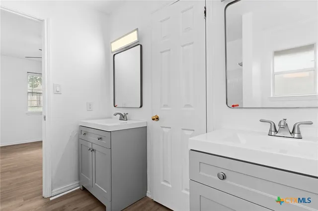 a bathroom with a sink and a mirror