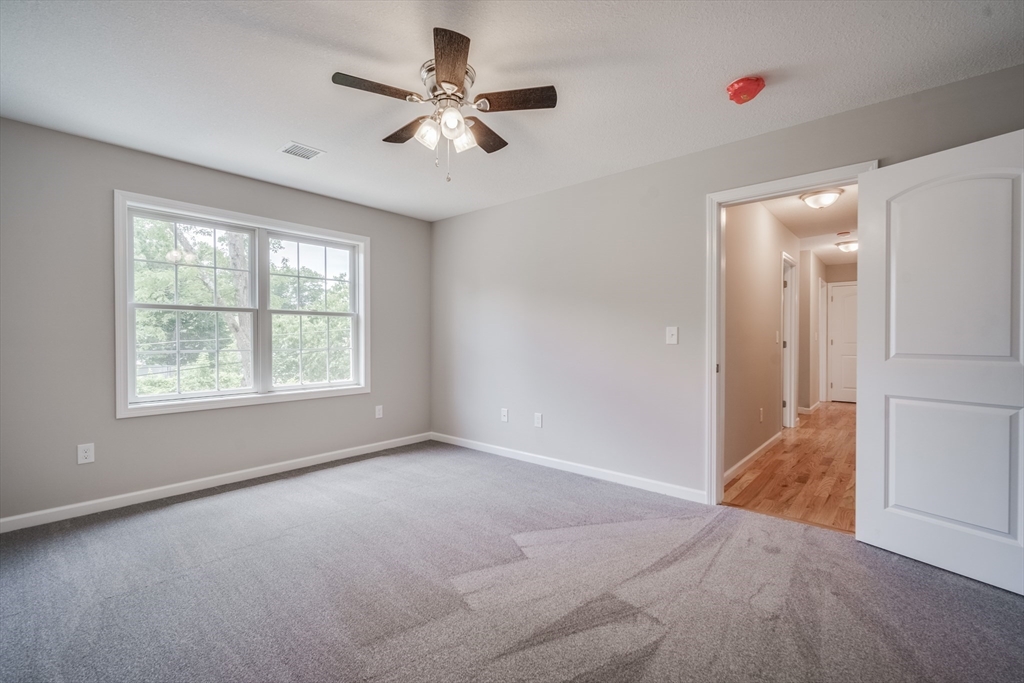 10 Kittrell Street Springfield, MA 01119 - Photo 24 of 42 an empty room with fan and windows