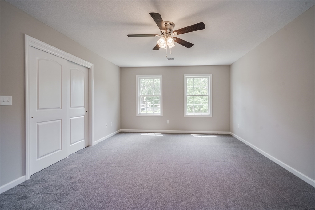 10 Kittrell Street Springfield, MA 01119 - Photo 29 of 42 an empty room with windows and fan