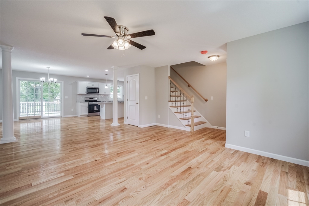 10 Kittrell Street Springfield, MA 01119 - Photo 9 of 42 a view of empty room with wooden floor and fan