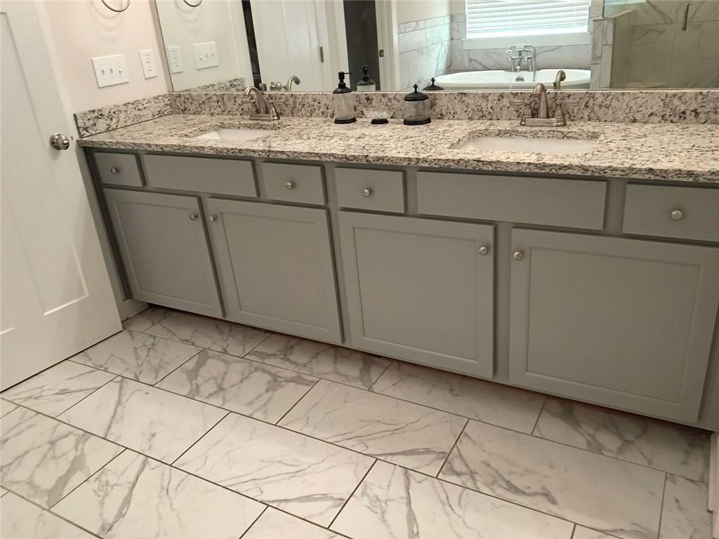 807 Ridgeview Court Hampton, GA 30228 - Photo 43 of 69 a bathroom with a granite countertop sink and a mirror