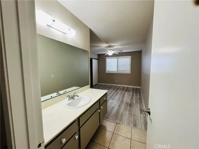 a room with a sink cabinets and utility room