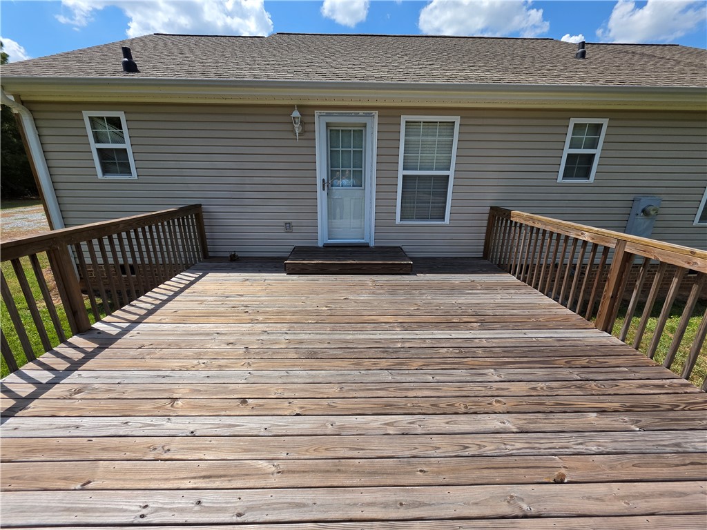 325 McAdams School Road Honea Path, SC 29654 - Photo 21 of 22 A spacious wooden deck extends from the residence, perfect for outdoor enjoyment.