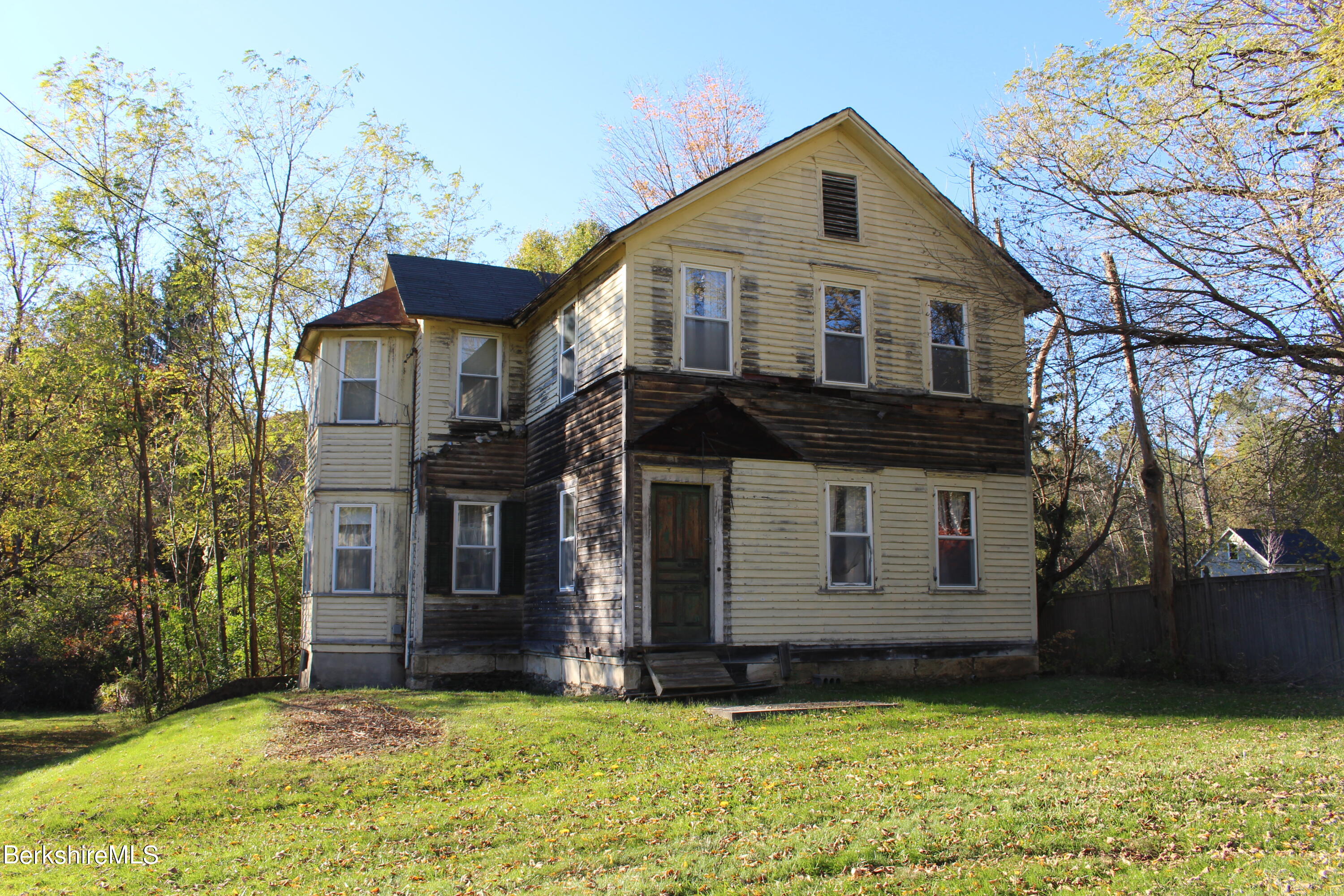 1 Pittsfield Road Lenox, MA 01240 - Photo 1 of 14 a front view of a house with a yard