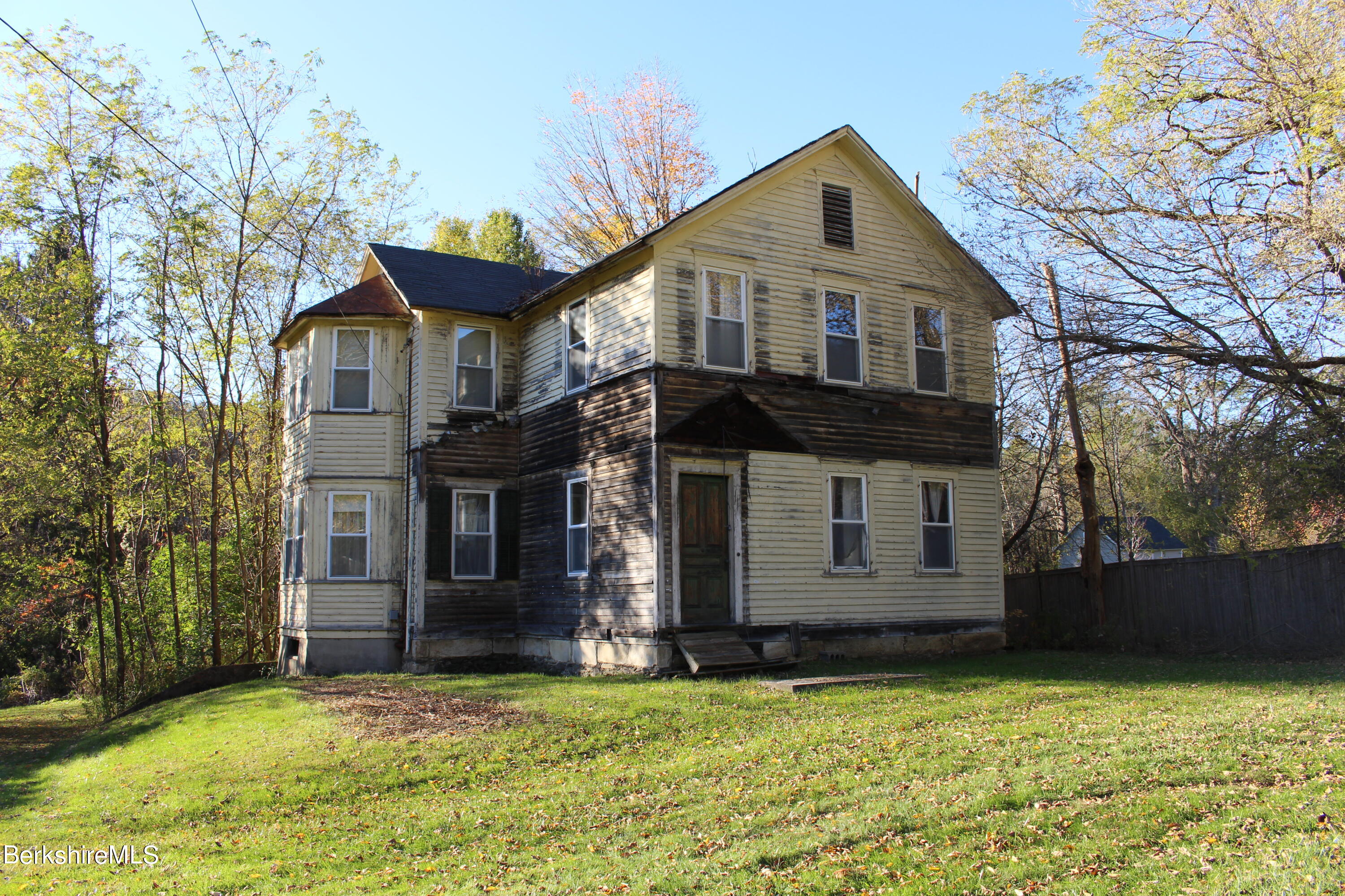 1 Pittsfield Road Lenox, MA 01240 - Photo 2 of 14 a front view of a house with a yard