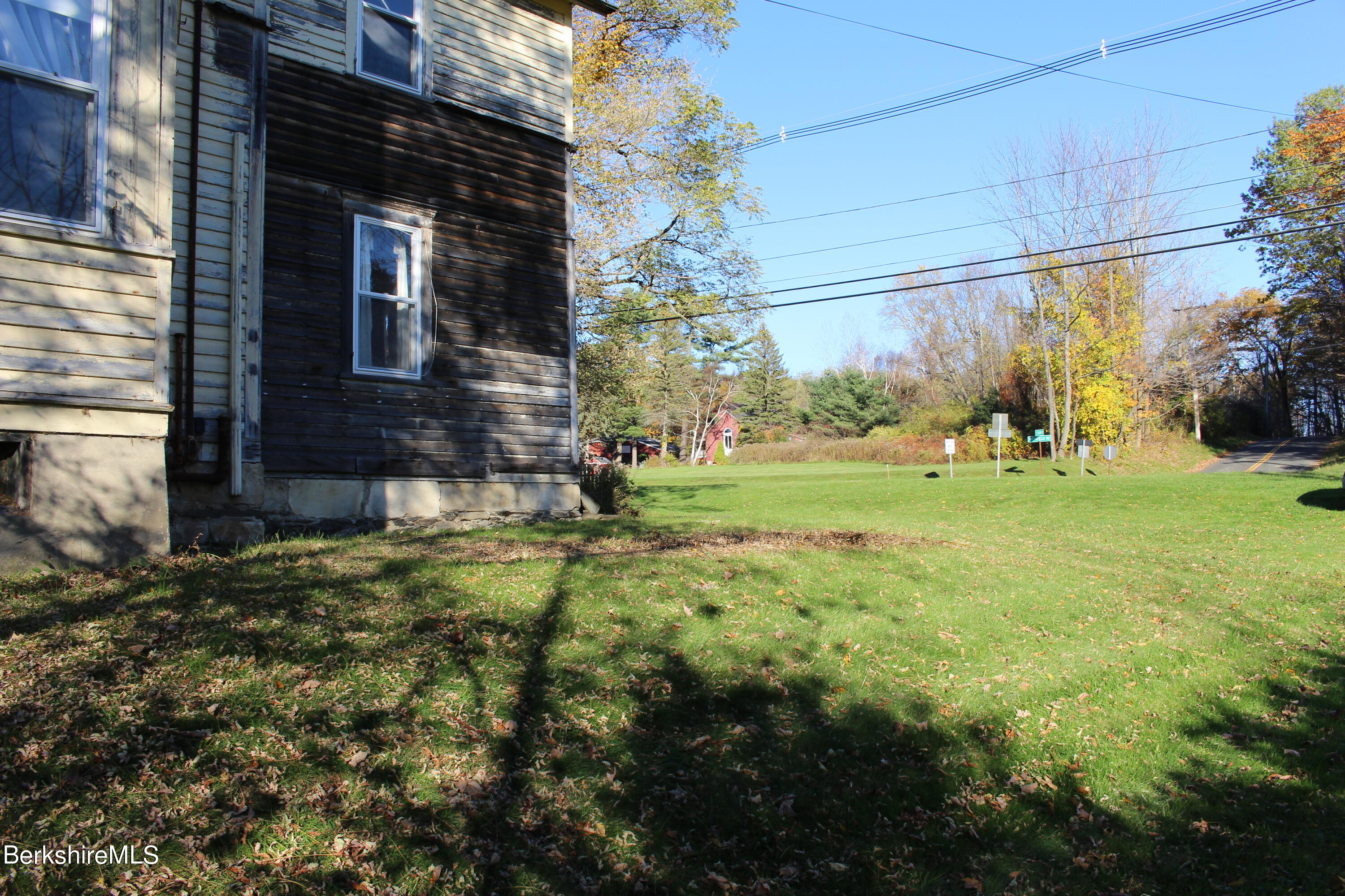 1 Pittsfield Road Lenox, MA 01240 - Photo 6 of 14 a backyard of a house with a yard and outdoor seating