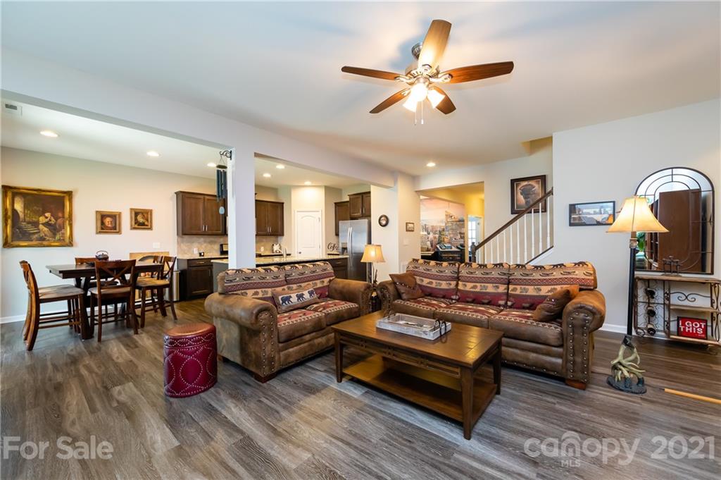 4822 Abendego Road Charlotte, NC 28213 - Photo 21 of 48 a living room with furniture a couch and a chandelier