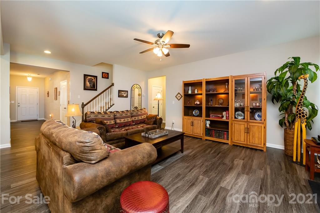4822 Abendego Road Charlotte, NC 28213 - Photo 22 of 48 a living room with furniture and wooden floor
