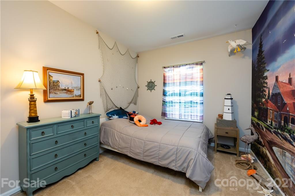 4822 Abendego Road Charlotte, NC 28213 - Photo 23 of 48 a bedroom with bed window and furniture