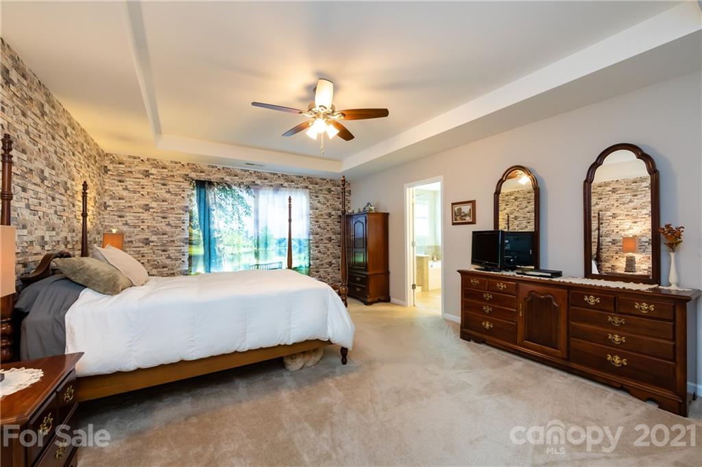 4822 Abendego Road Charlotte, NC 28213 - Photo 29 of 48 a bed room with a bed and a dresser