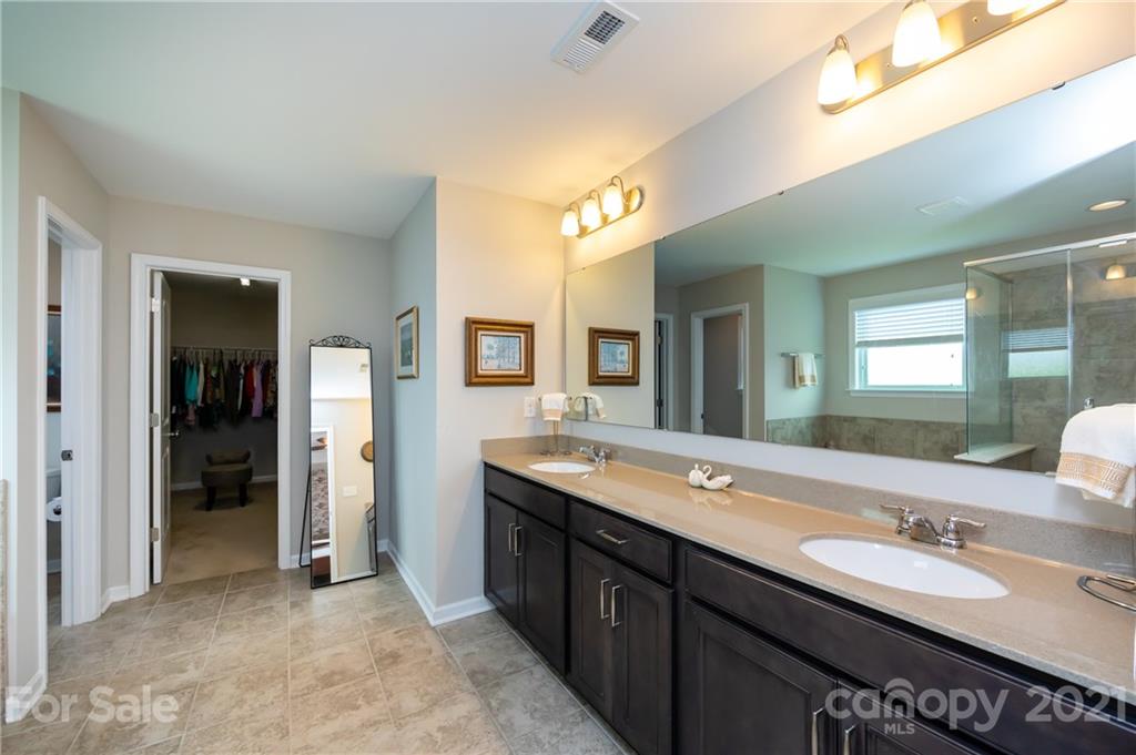4822 Abendego Road Charlotte, NC 28213 - Photo 32 of 48 a bathroom with a granite countertop sink and a mirror