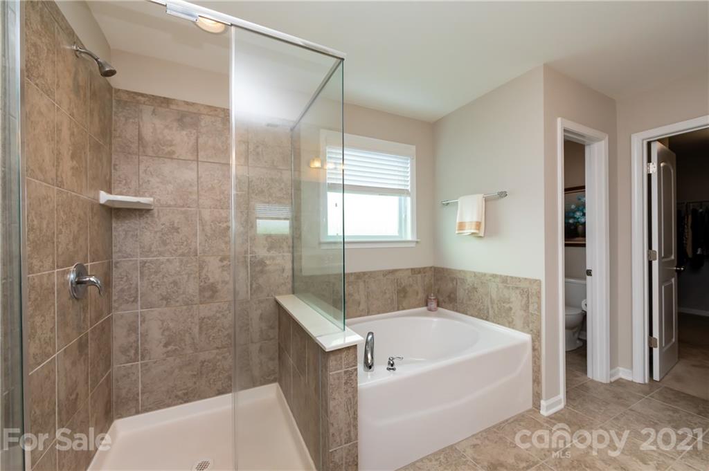 4822 Abendego Road Charlotte, NC 28213 - Photo 34 of 48 a white bath tub sitting next to a white sink