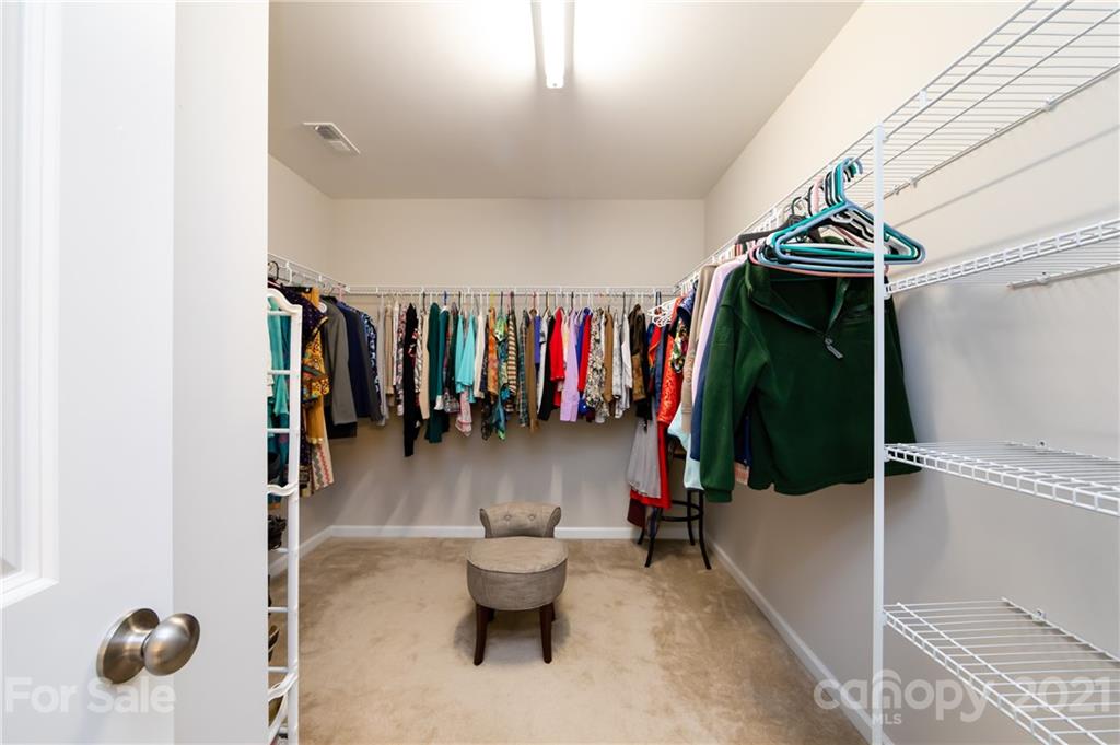 4822 Abendego Road Charlotte, NC 28213 - Photo 36 of 48 a view of walk in closet with clothes and shoes